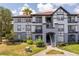Two-story building exterior, featuring gray and white accents at 3702 Palm Desert Ln # 5431, Orlando, FL 32839