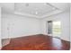 Bright living room with wood floors and access to balcony at 3702 Palm Desert Ln # 5431, Orlando, FL 32839