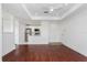 Open living room and kitchen area with wood floors and modern appliances at 3702 Palm Desert Ln # 5431, Orlando, FL 32839