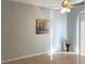 Sunlit dining room with tile floors and wall art at 6910 Kelcher Ct, Orlando, FL 32807