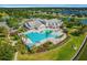 Aerial view of community pool and clubhouse at 8664 Bridgeport Bay Cir, Mount Dora, FL 32757