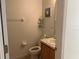 Small half bathroom with toilet and vanity at 238 Carrera Ave, Davenport, FL 33897