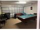 Finished garage with pool table, foosball, and storage at 238 Carrera Ave, Davenport, FL 33897
