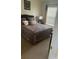Spacious bedroom with plush bedding and window coverings at 238 Carrera Ave, Davenport, FL 33897