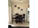 Cozy kitchen nook with a round table and four chairs at 238 Carrera Ave, Davenport, FL 33897