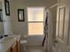 Bathroom with a shower/tub combo, vanity, and window at 238 Carrera Ave, Davenport, FL 33897
