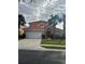 Two-story home with a two-car garage at 238 Carrera Ave, Davenport, FL 33897