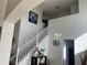 Elegant staircase with white railings leading to the upper level at 238 Carrera Ave, Davenport, FL 33897