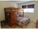 Bedroom with a built-in bunk bed and desk area at 238 Carrera Ave, Davenport, FL 33897