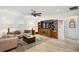 Spacious living room with ample natural light and a large TV at 1511 Orange Valley Rdg, Ocoee, FL 34761