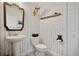 Charming half-bathroom with unique nature-themed wallpaper at 1511 Orange Valley Rdg, Ocoee, FL 34761