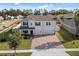 Two-story house with a large driveway and landscaped yard at 1511 Orange Valley Rdg, Ocoee, FL 34761