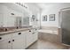 Elegant bathroom with double vanity and soaking tub at 1511 Orange Valley Rdg, Ocoee, FL 34761