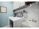 Convenient laundry room with washer, dryer, and utility sink at 1511 Orange Valley Rdg, Ocoee, FL 34761