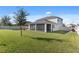 Large backyard with spacious lawn and screened patio at 1511 Orange Valley Rdg, Ocoee, FL 34761