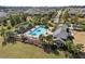 Resort-style community pool with lounge chairs and palm trees at 1511 Orange Valley Rdg, Ocoee, FL 34761