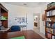 Bright office space with a large desk, built-in shelving and adjacent bathroom at 1511 Orange Valley Rdg, Ocoee, FL 34761