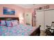 Bedroom with a queen bed, closet, and access to another room at 1511 Orange Valley Rdg, Ocoee, FL 34761