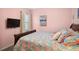 Bright bedroom with a queen-size bed and a flat-screen TV at 1511 Orange Valley Rdg, Ocoee, FL 34761