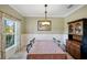 Formal dining room featuring a wood table and hutch at 1511 Orange Valley Rdg, Ocoee, FL 34761