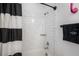 Clean bathroom with a white subway tile shower and a black vanity at 1511 Orange Valley Rdg, Ocoee, FL 34761