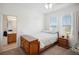 Well-lit bedroom with ensuite bathroom and ample dresser space at 1511 Orange Valley Rdg, Ocoee, FL 34761