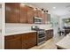 Kitchen with stainless steel appliances and white subway tile at 1511 Orange Valley Rdg, Ocoee, FL 34761