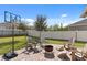 Backyard with fire pit, seating, and basketball hoop at 1511 Orange Valley Rdg, Ocoee, FL 34761