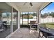 Screened patio with built-in gas grill and outdoor furniture at 1511 Orange Valley Rdg, Ocoee, FL 34761