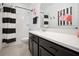 Stylish bathroom with black and white striped shower curtain at 1511 Orange Valley Rdg, Ocoee, FL 34761
