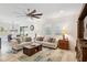Open living room with a view into the dining area and backyard at 1511 Orange Valley Rdg, Ocoee, FL 34761