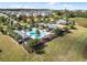 Community pool and clubhouse with surrounding landscape at 1511 Orange Valley Rdg, Ocoee, FL 34761
