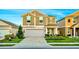 Two-story house with gray siding, green shutters, and landscaping at 1093 Berry Ln, Davenport, FL 33837