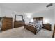 Primary bedroom with wood furniture and carpeted floor at 1093 Berry Ln, Davenport, FL 33837