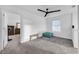 Bright bedroom with window, carpeted floor, and ceiling fan at 1093 Berry Ln, Davenport, FL 33837