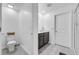 Bathroom with dark vanity, toilet, and shower at 1093 Berry Ln, Davenport, FL 33837