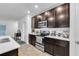 Modern kitchen with dark cabinets and stainless steel appliances at 1093 Berry Ln, Davenport, FL 33837