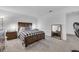 Spacious bedroom with wood bed frame and carpet flooring at 1093 Berry Ln, Davenport, FL 33837