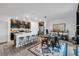Modern kitchen with island, stainless steel appliances, and dark cabinets at 1093 Berry Ln, Davenport, FL 33837