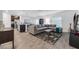 Living room with L-shaped sofa and view of kitchen at 1093 Berry Ln, Davenport, FL 33837