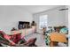 Bedroom with TV and plaid chair, ready to be customized at 1093 Berry Ln, Davenport, FL 33837