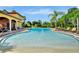 Resort-style pool with lounge chairs and palm trees at 600 Via Chris Ct, Debary, FL 32713