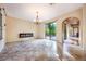 Living area with tile floors, fireplace, and access to backyard patio at 600 Via Chris Ct, Debary, FL 32713
