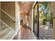 Long hallway with hardwood floors, leading to backyard at 600 Via Chris Ct, Debary, FL 32713