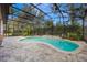 Relaxing kidney-shaped pool with screened enclosure and water features at 600 Via Chris Ct, Debary, FL 32713