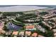 Aerial view of community with lake, homes, and shared amenities at 600 Via Chris Ct, Debary, FL 32713