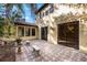 Brick paved patio with two stone benches and potted plants at 600 Via Chris Ct, Debary, FL 32713