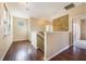 Upstairs hallway with wood floors and access to bedrooms at 600 Via Chris Ct, Debary, FL 32713