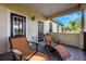 Relaxing balcony with lounge chairs and access to two doors at 600 Via Chris Ct, Debary, FL 32713
