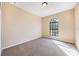 Well lit bedroom featuring carpet and an arched window at 600 Via Chris Ct, Debary, FL 32713
